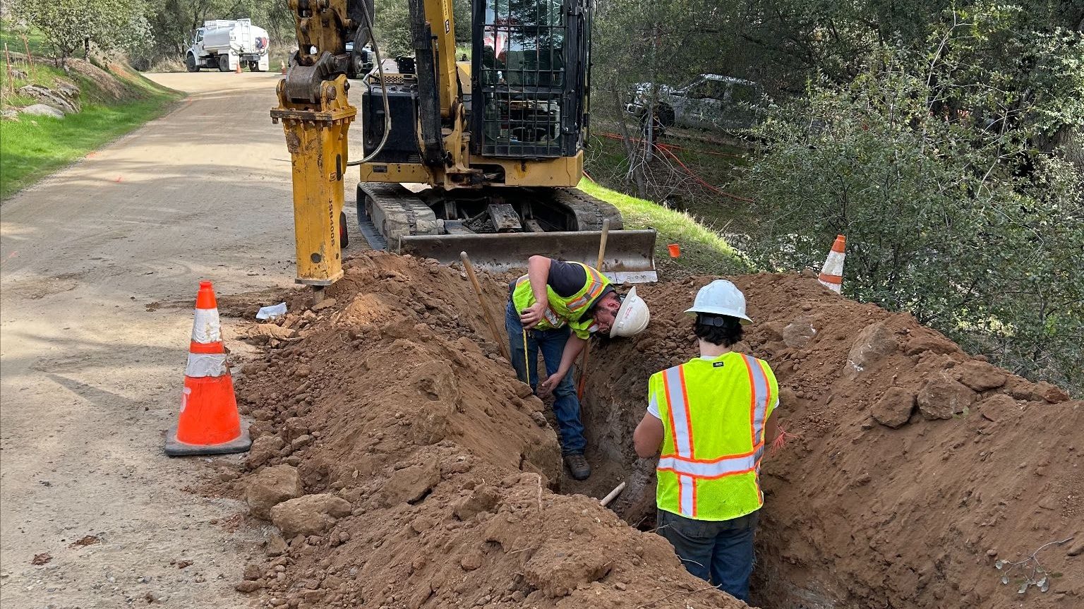 Emergency road work with safety cones after a storm